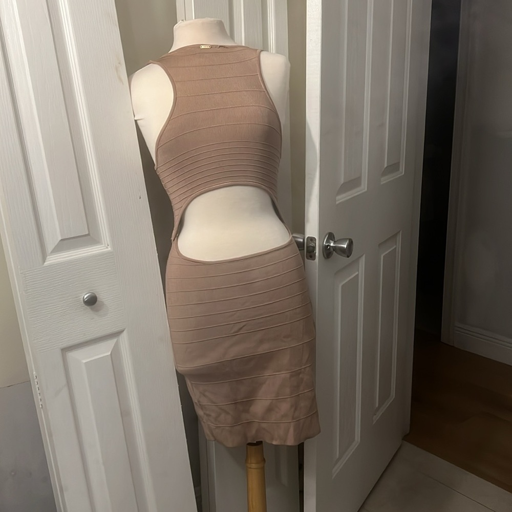 Baby Brown dress with open in the back and cut outs in the front size medium